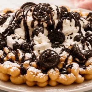 Cookies and cream funnel cake with crushed Oreo